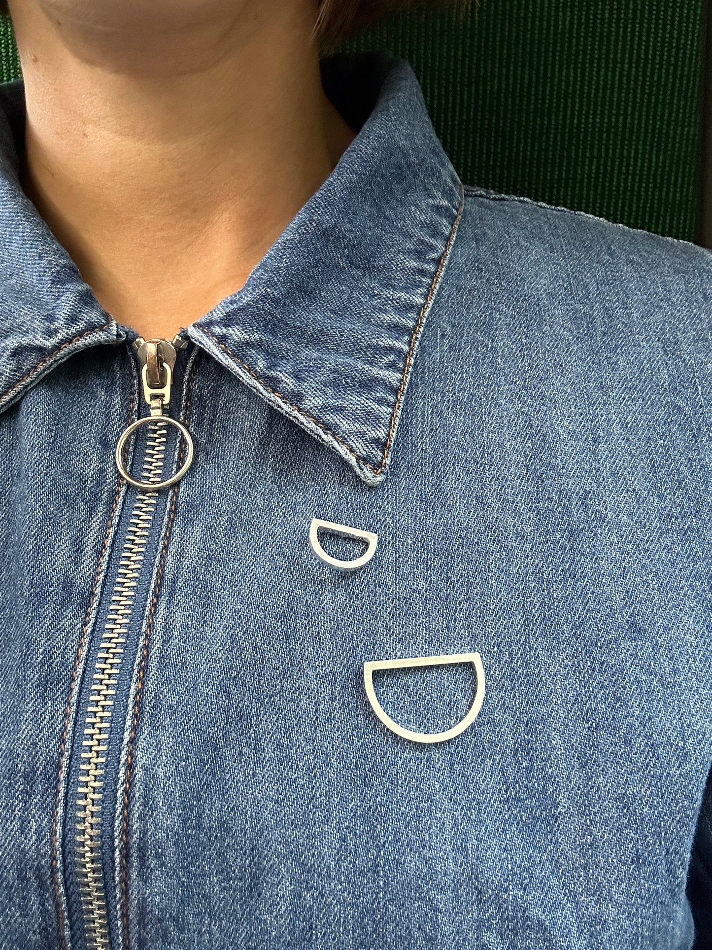 arc brooch set worn on a denim dress
