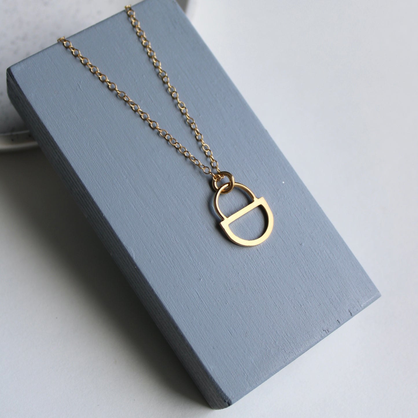 arc double gold pendant