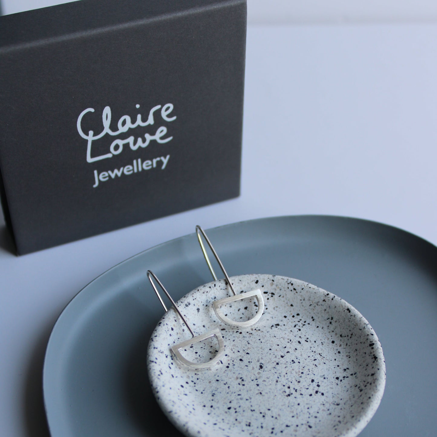 silver arc drop earrings