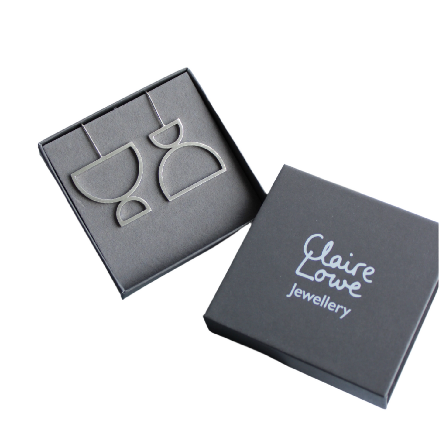 arc odd drop earrings in box