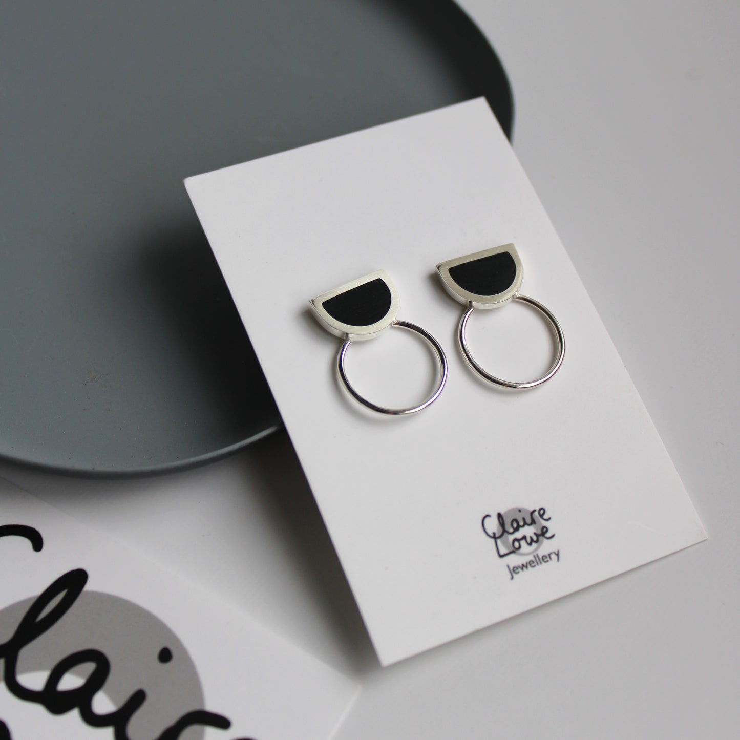 black resin and silver arc circle earrings