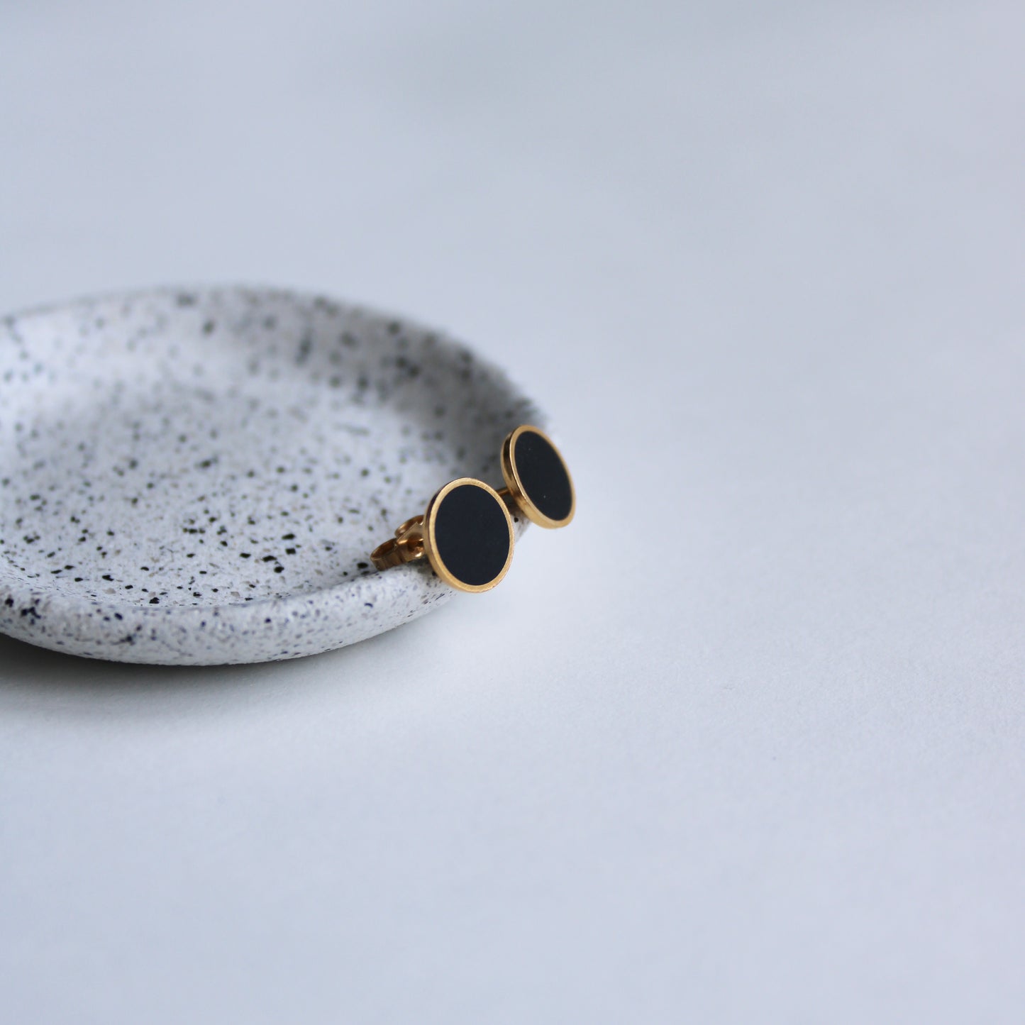 black arc stud earrings gold