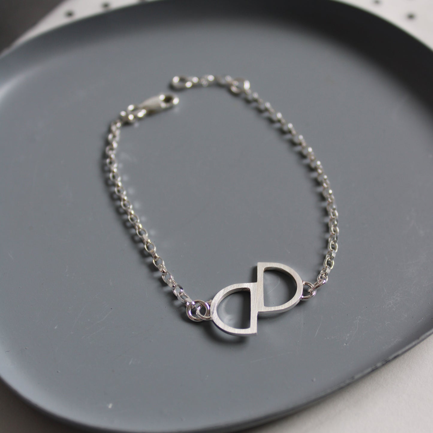 silver double arc bracelet