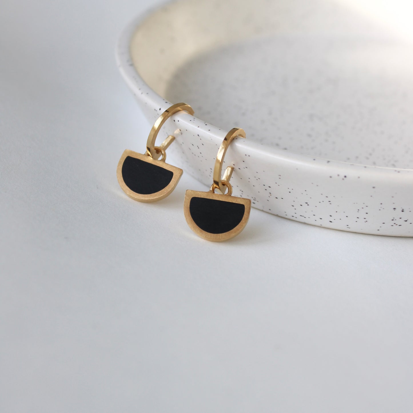 gold arc hoop with black resin