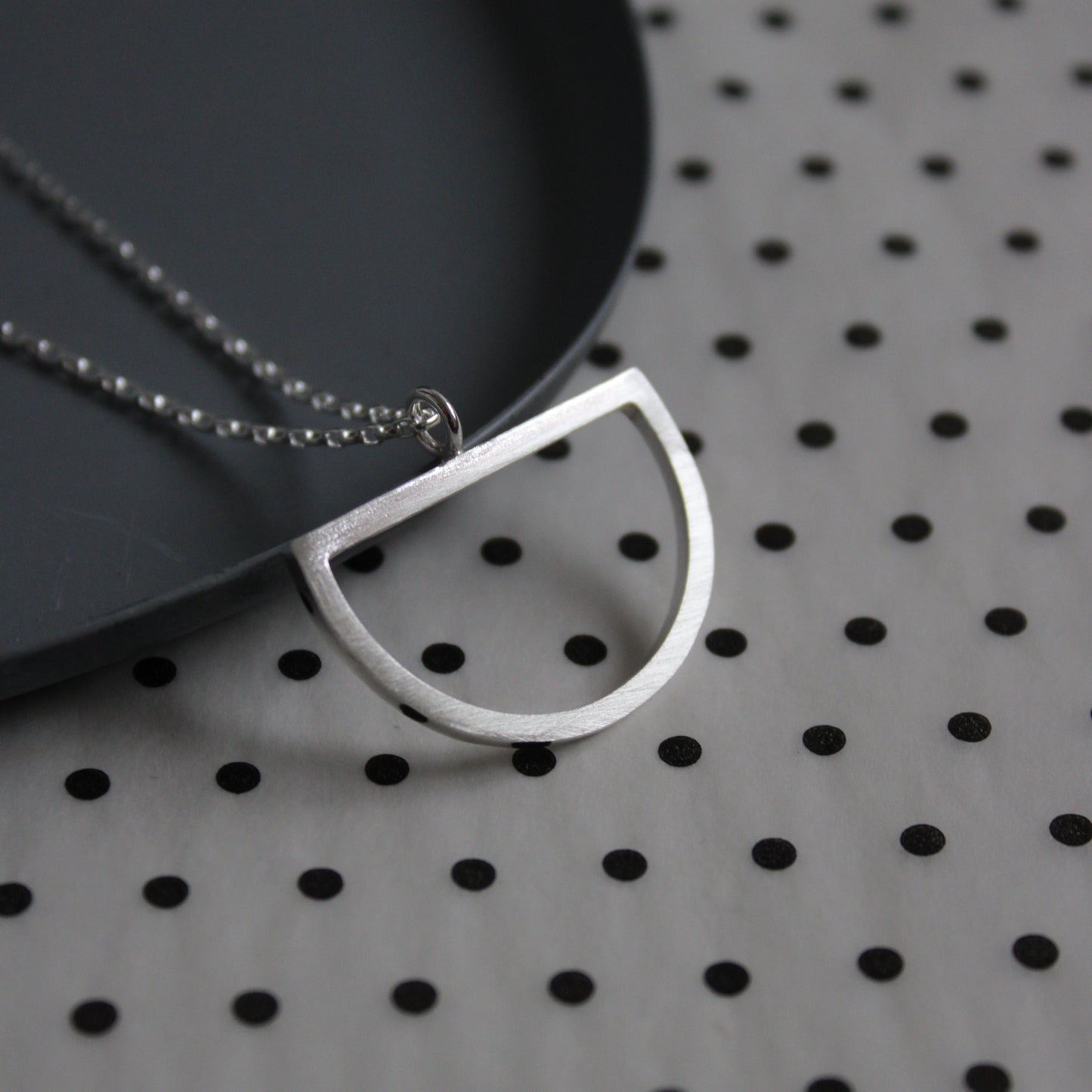 large silver arc pendant