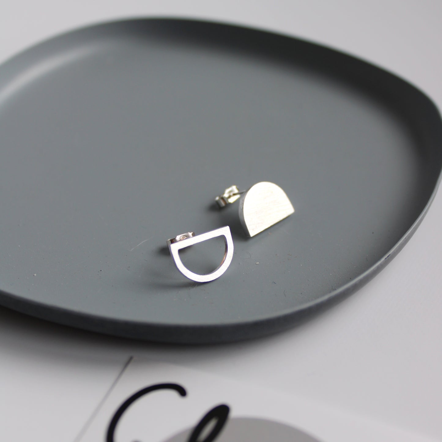 odd arc stud earrings