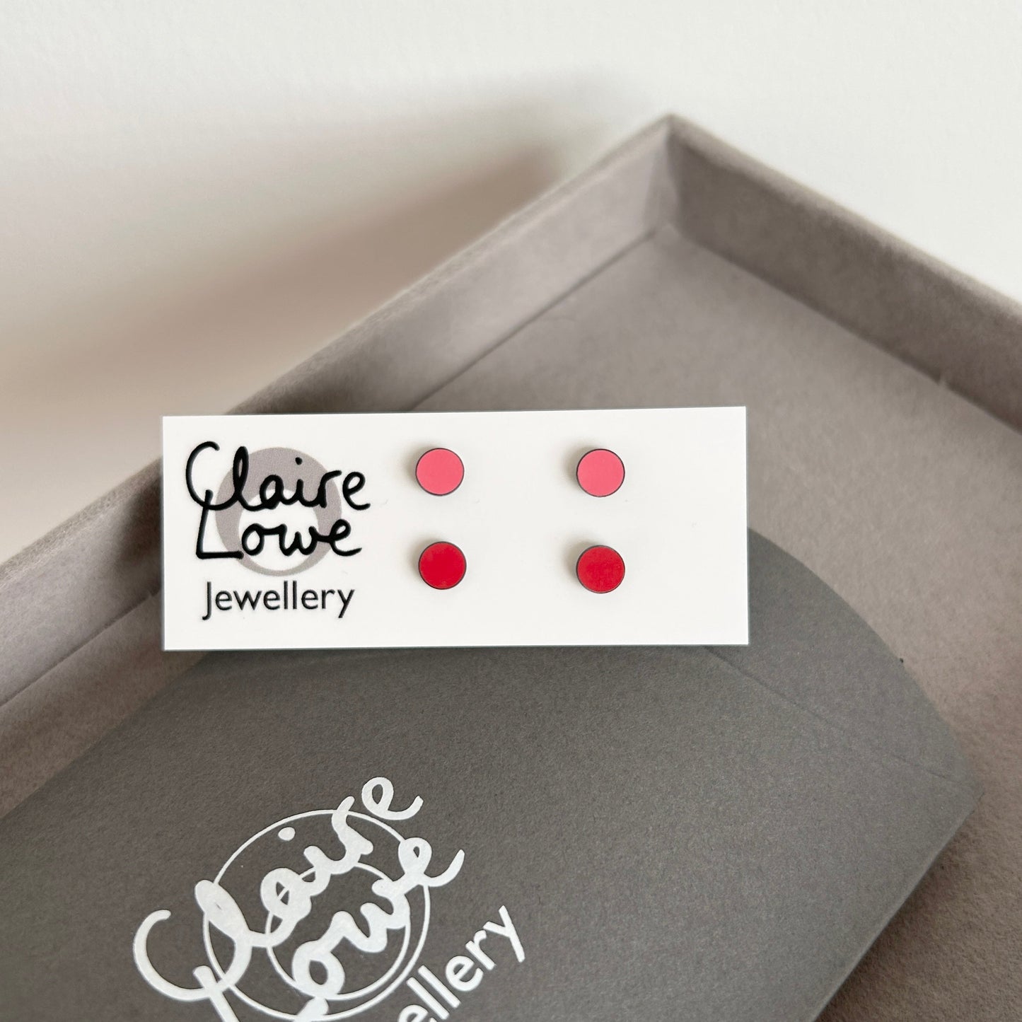 pink and red stud earrings