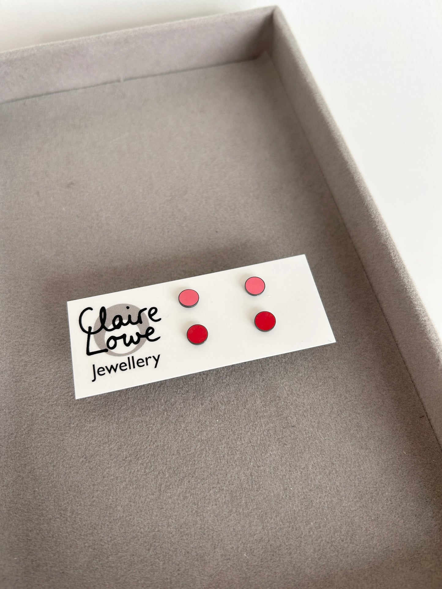pink and red stud earrings