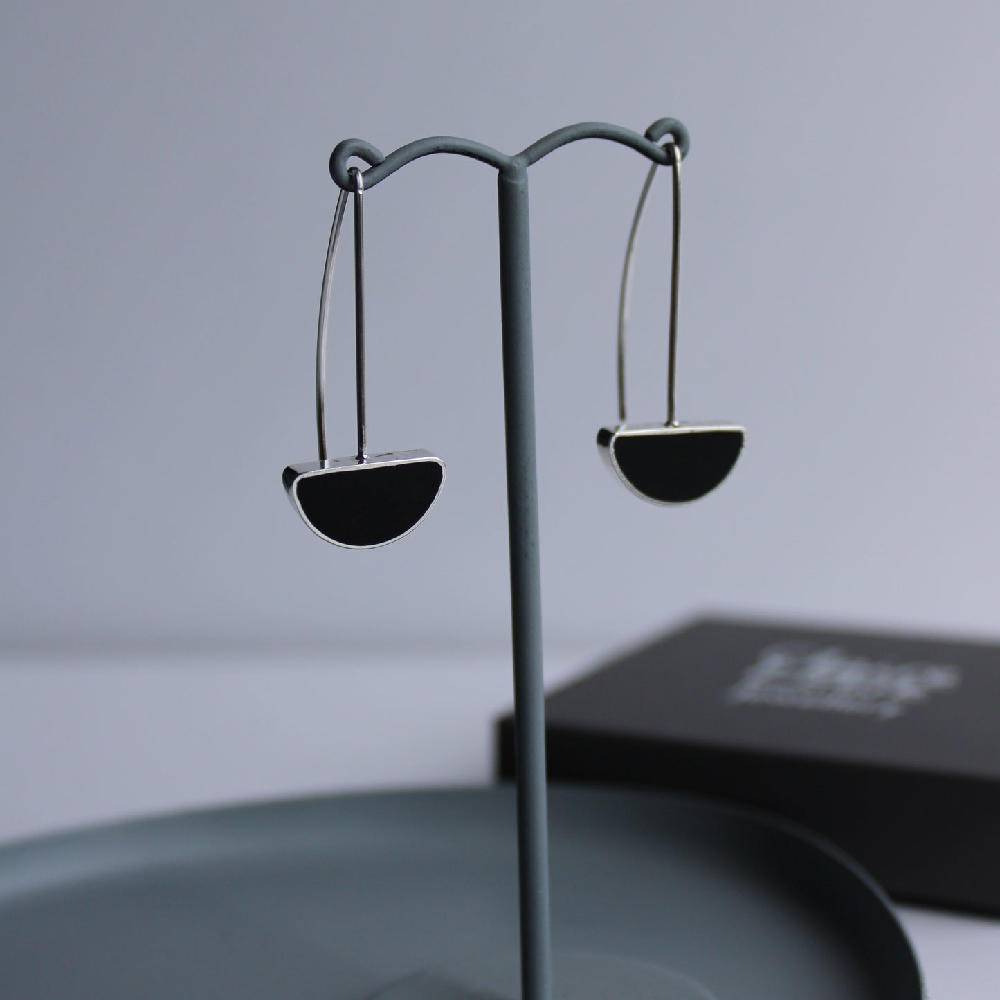 silver and black arc drop earrings