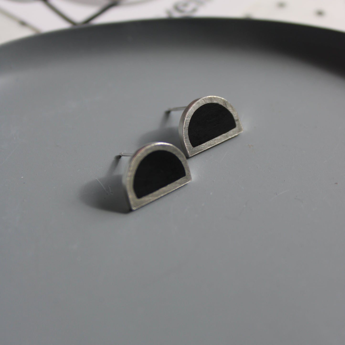 silver and black resin arc stud earrings