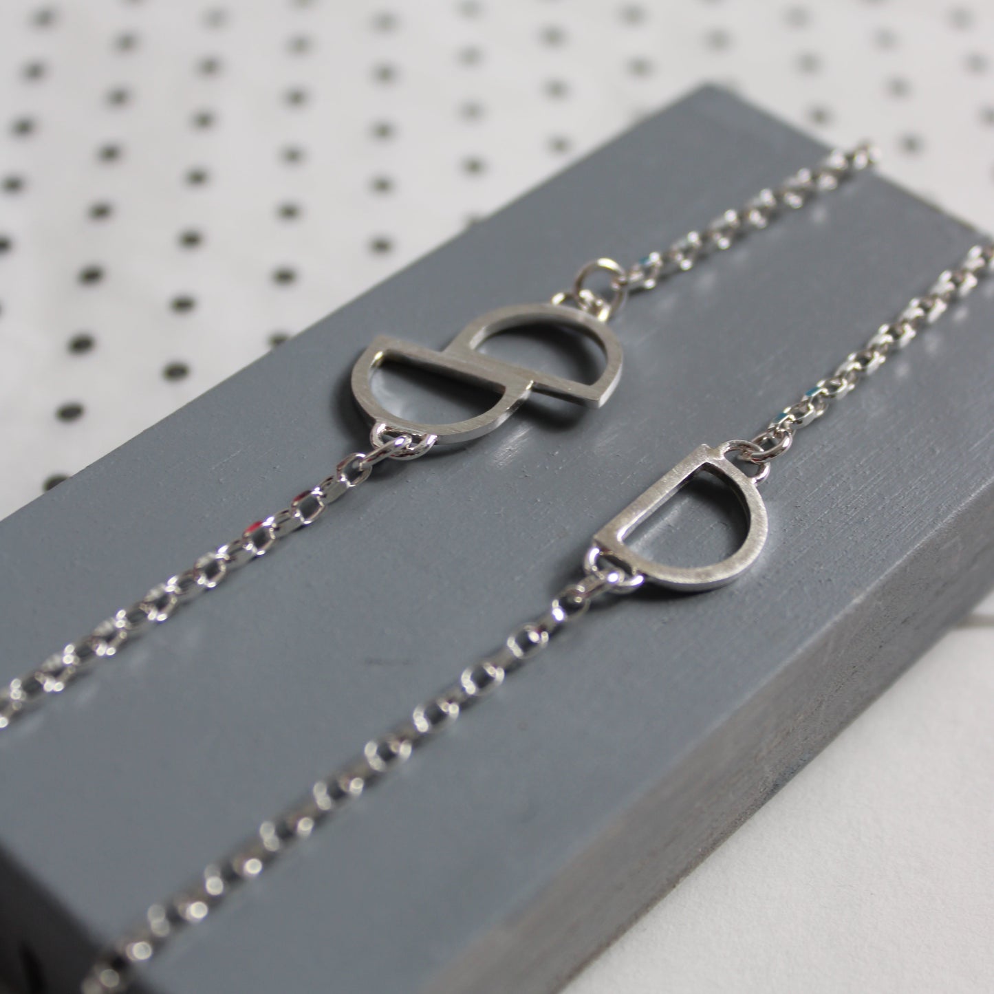 silver arc bracelets