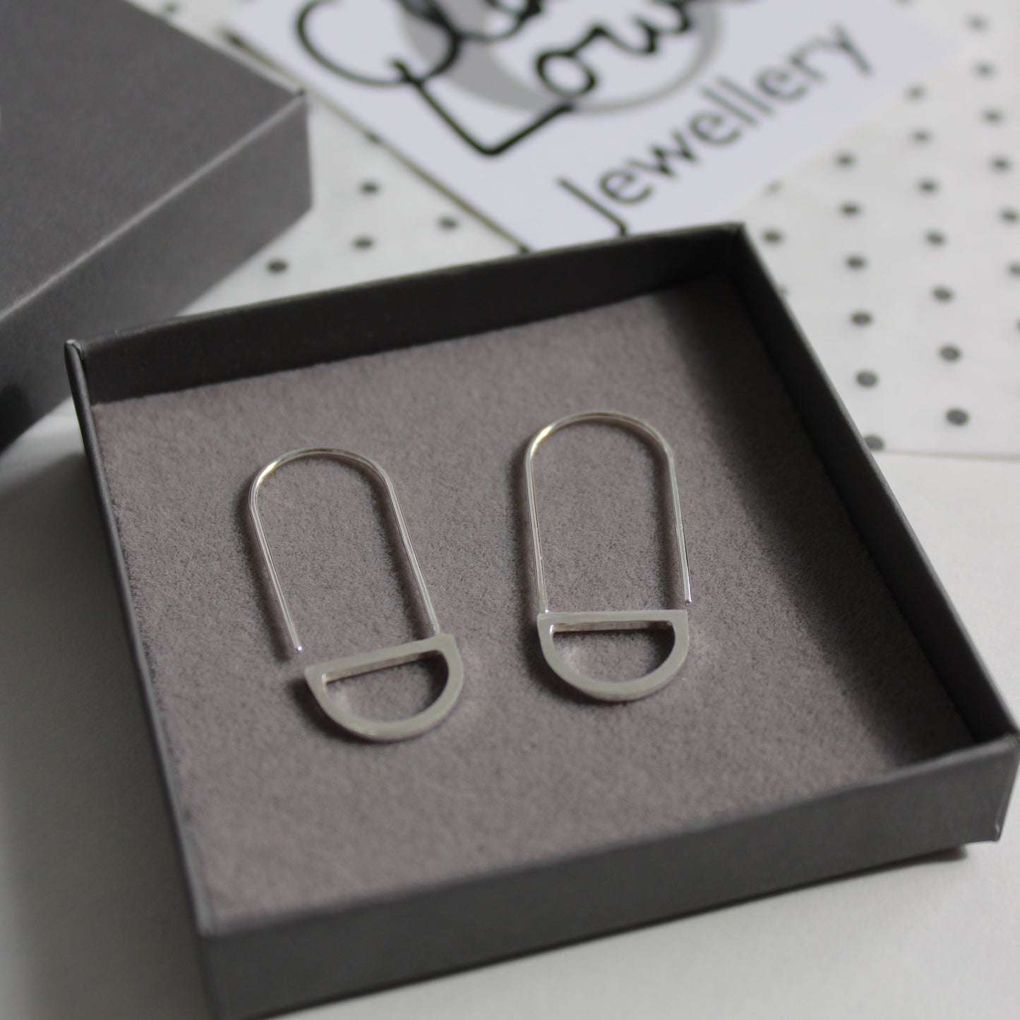 silver arc loop earrings