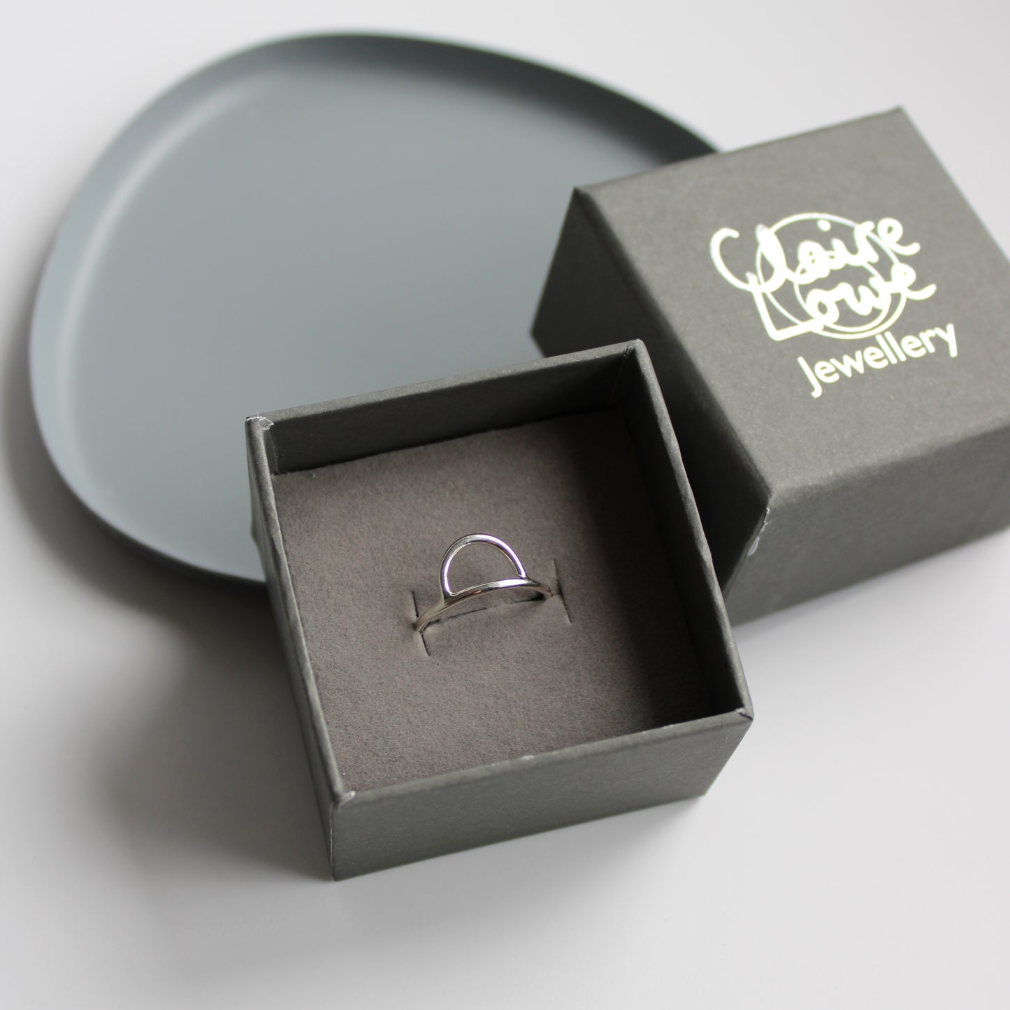 silver arc ring in box