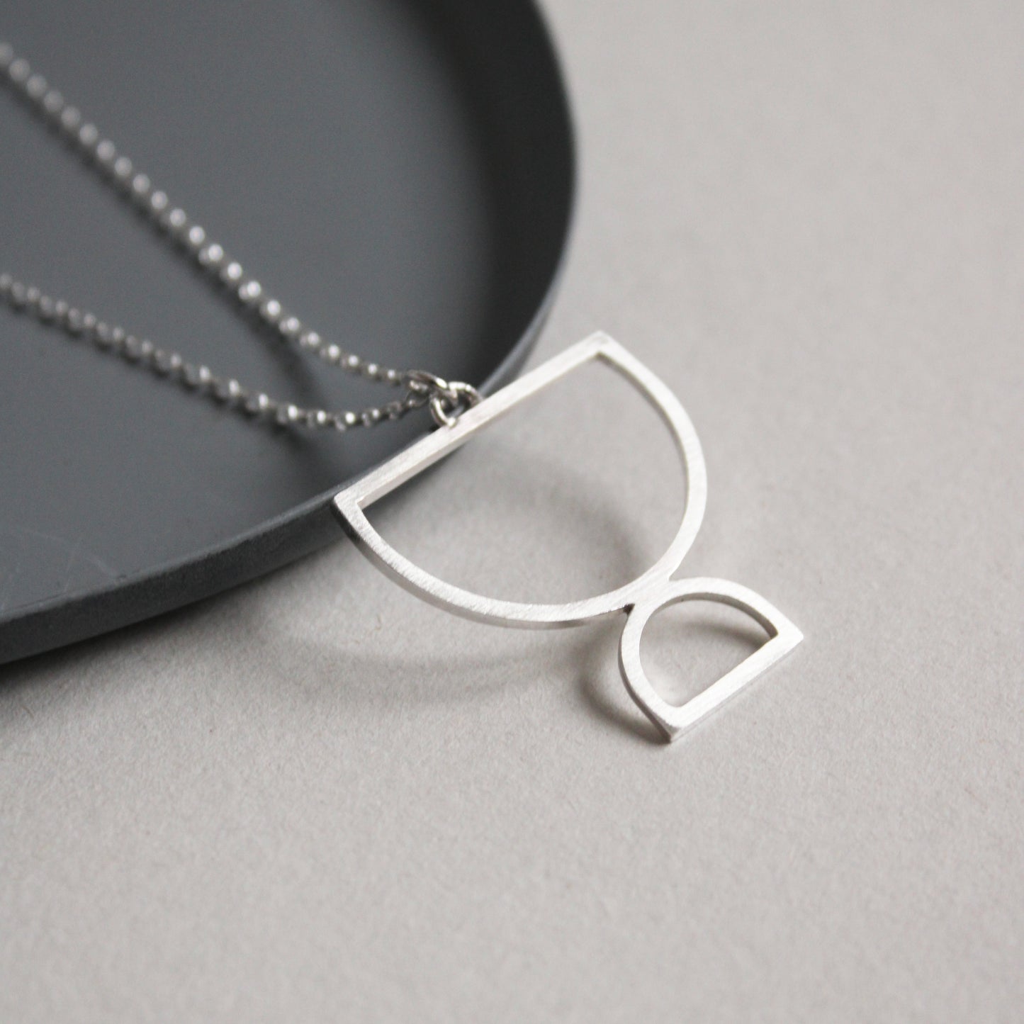 silver double arc pendant