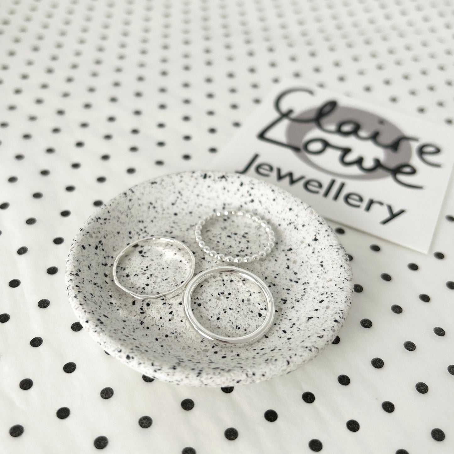 stacking ring set silver, on a dish