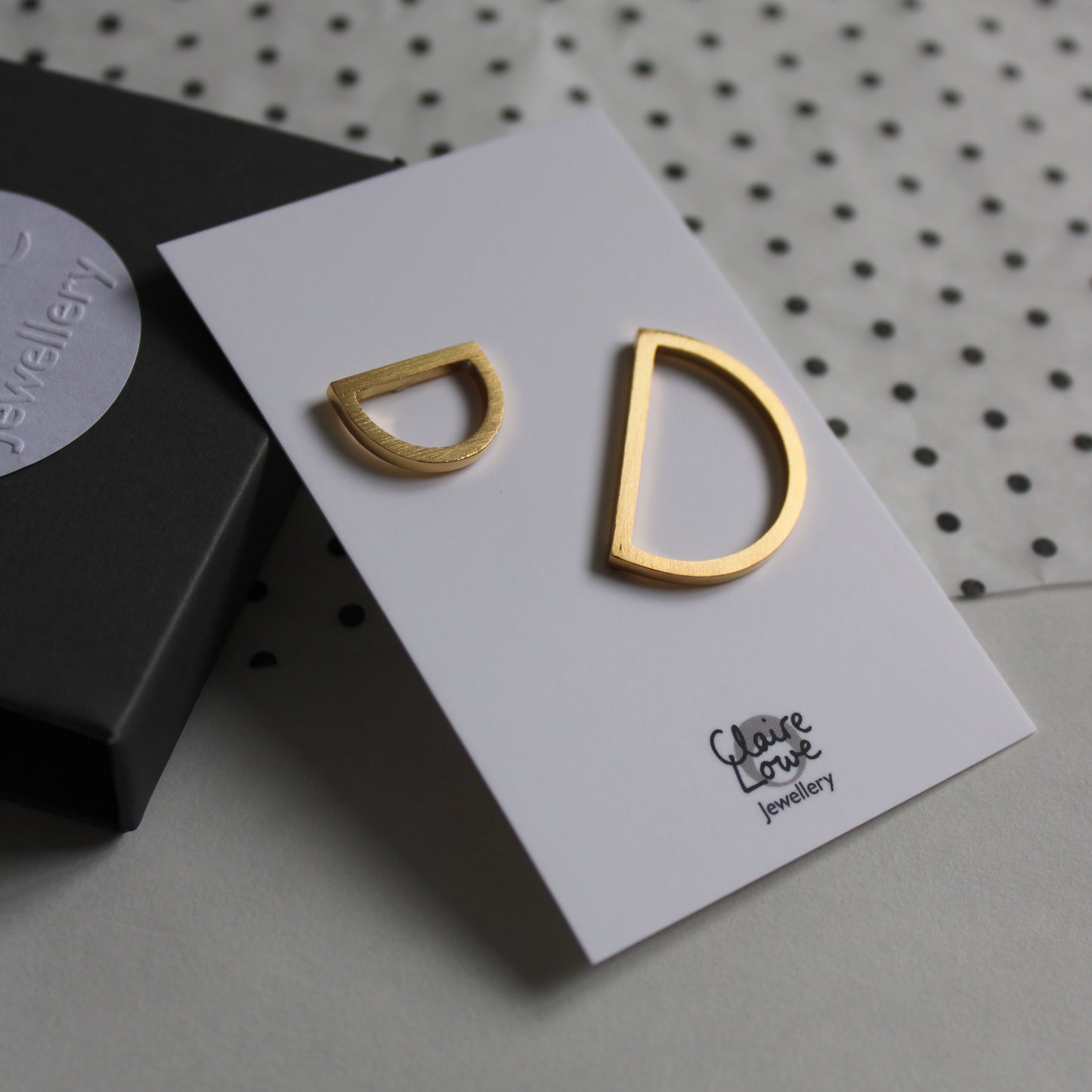2 gold arc pins
