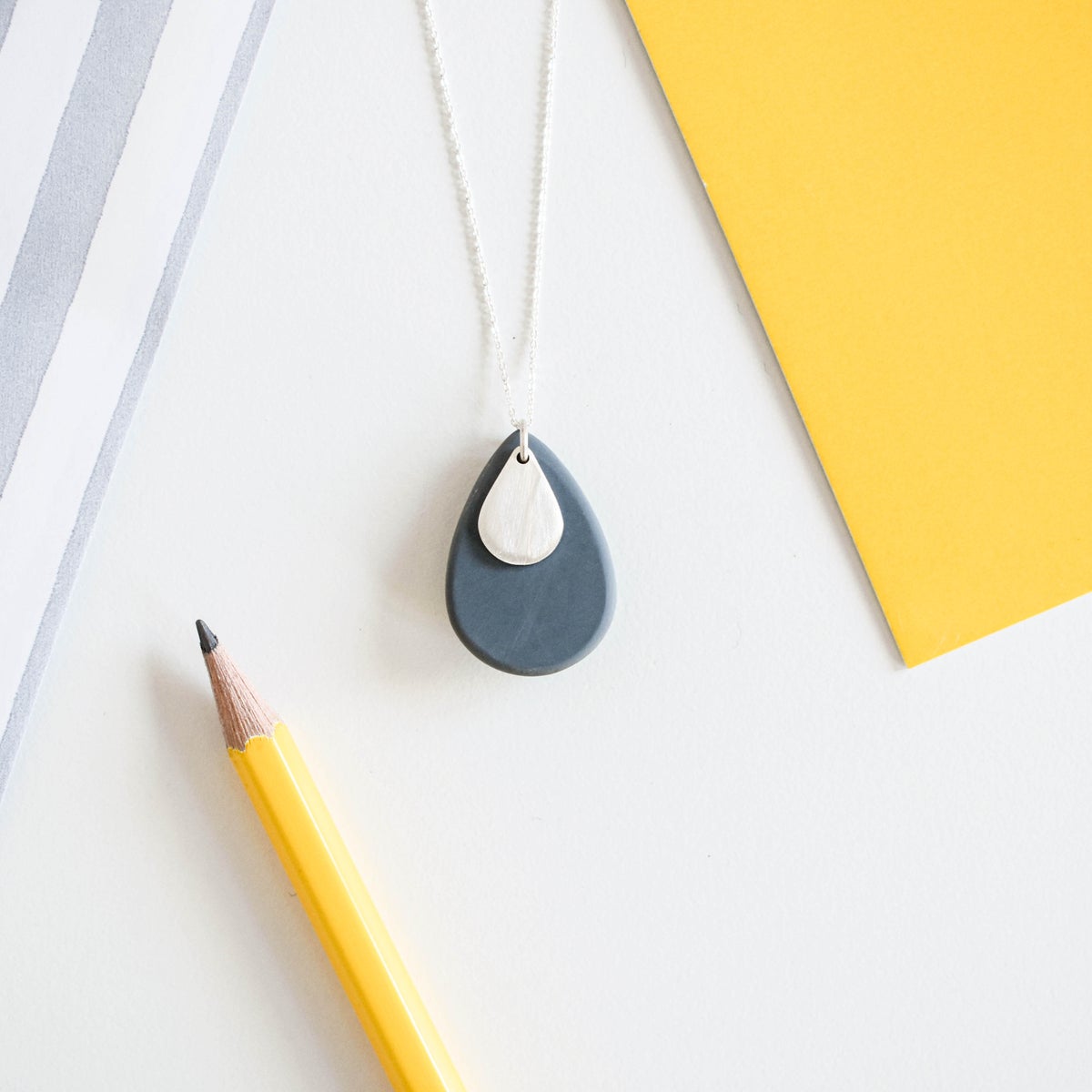 grey resin and silver pebble pendant