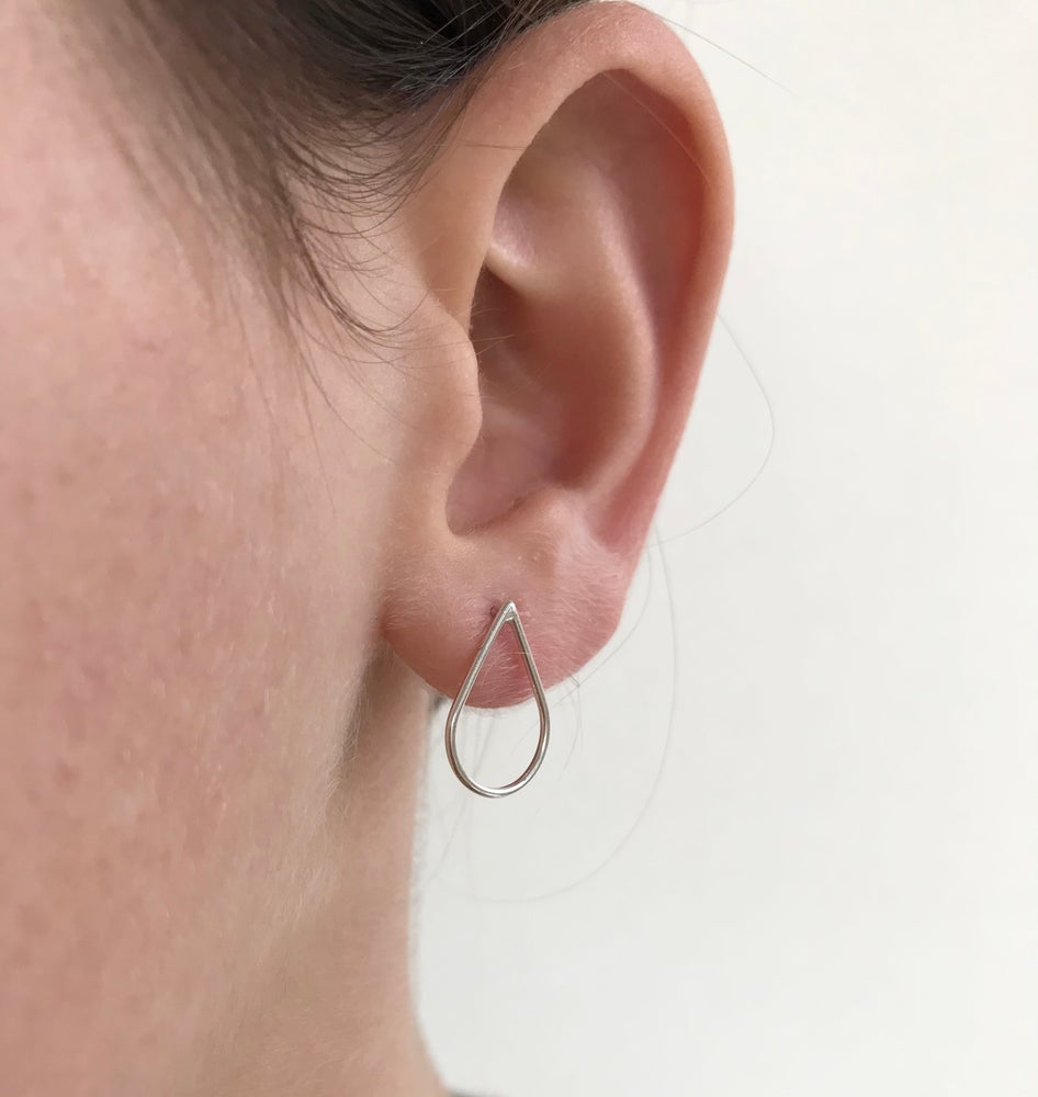 teardrop studs worn