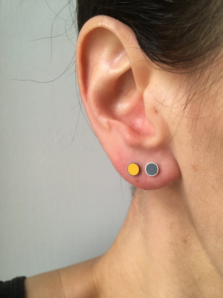 tiny resin studs worn