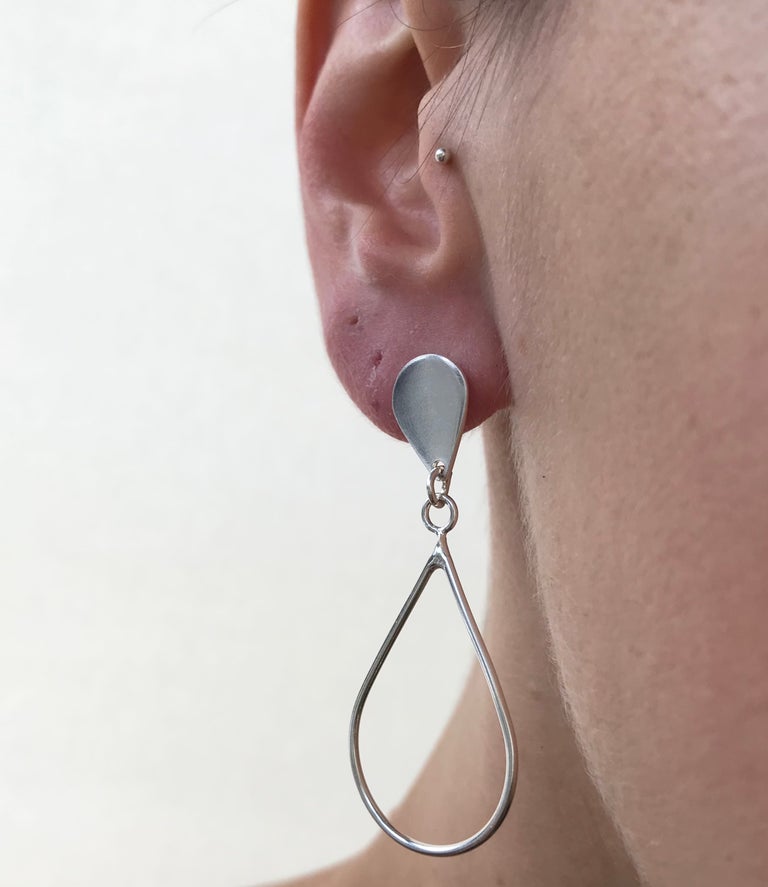 worn large teardrop earrings