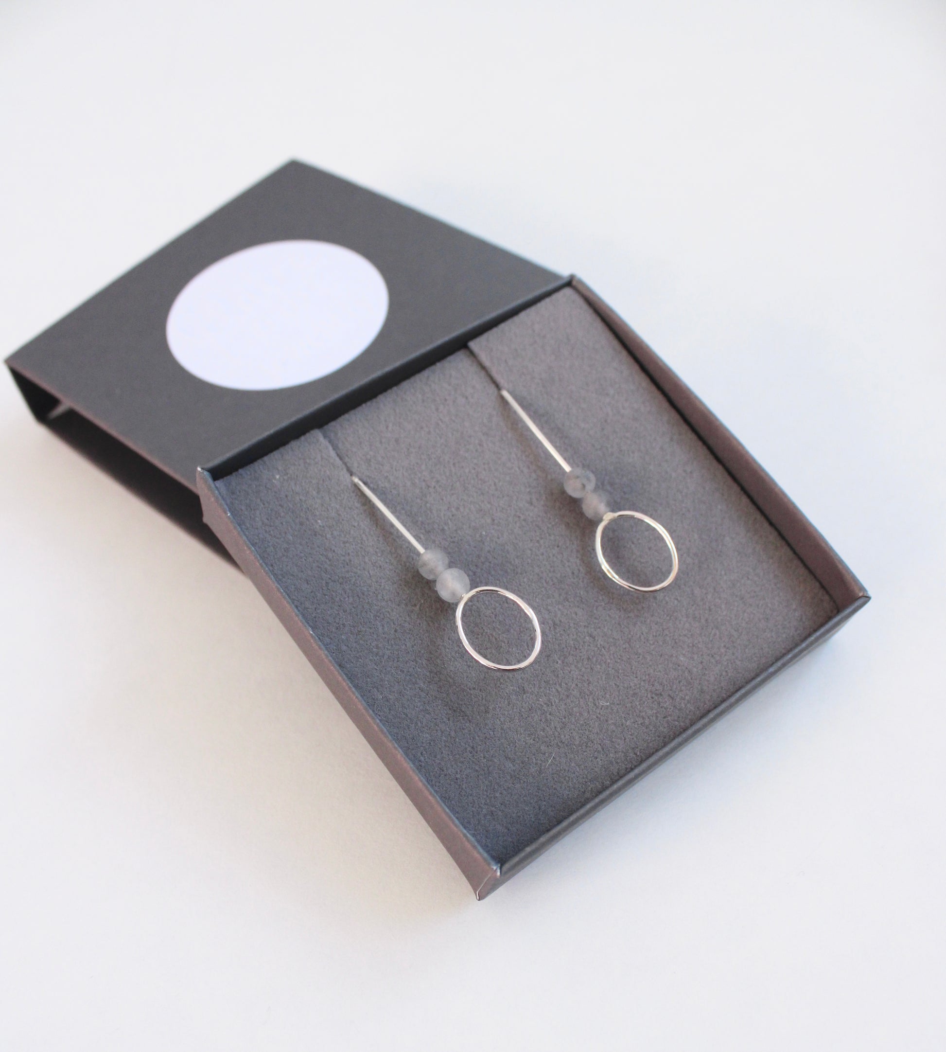agate and silver drop earrings in box