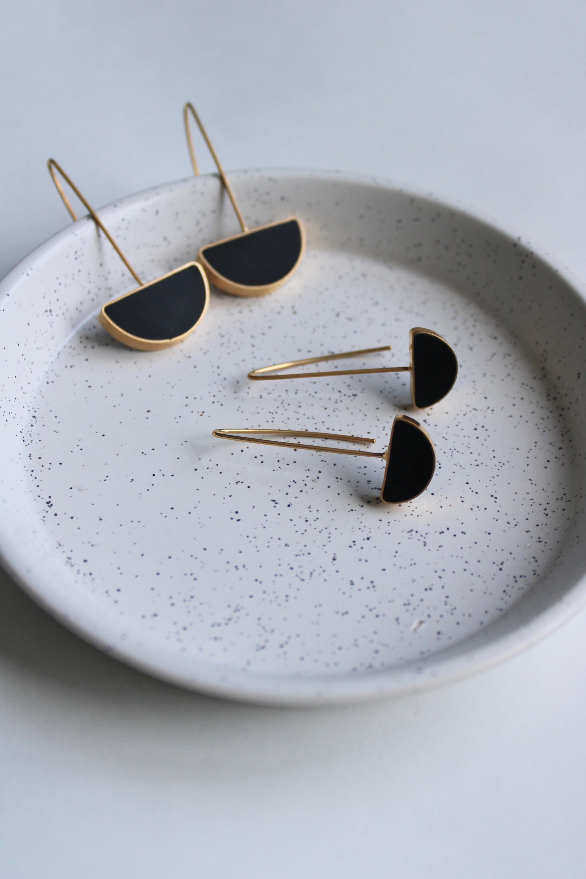 arc black resin and gold drop earrings