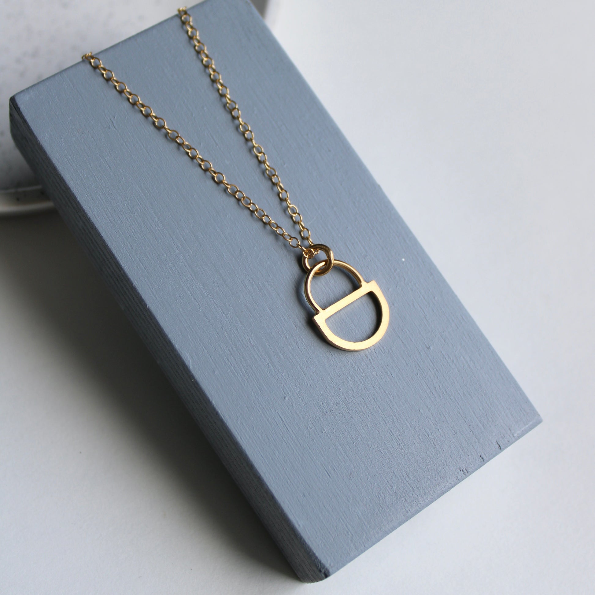 arc double gold pendant