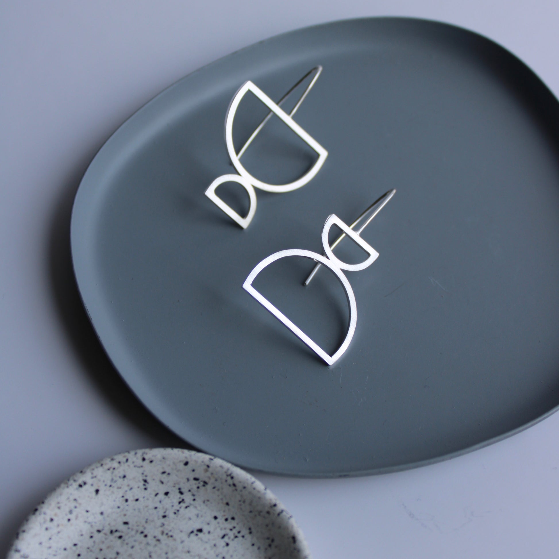 arc drop earrings odd