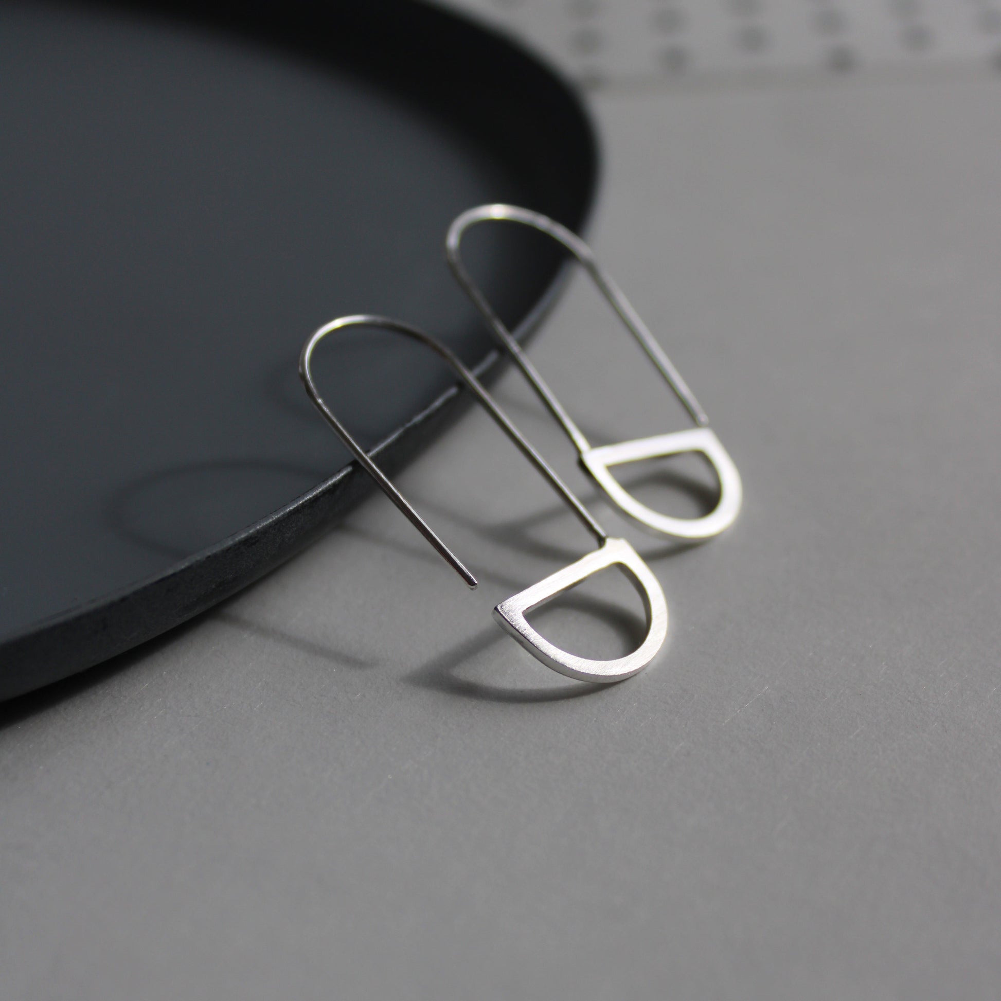 silver arc loop earrings