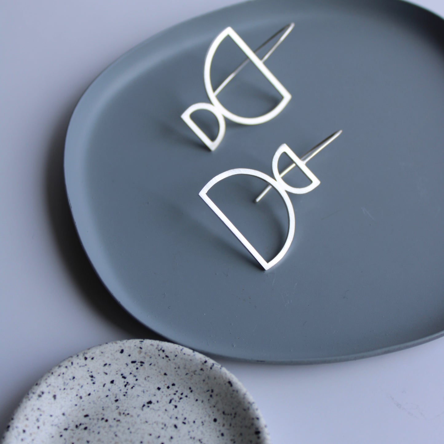 arc odd drop earrings