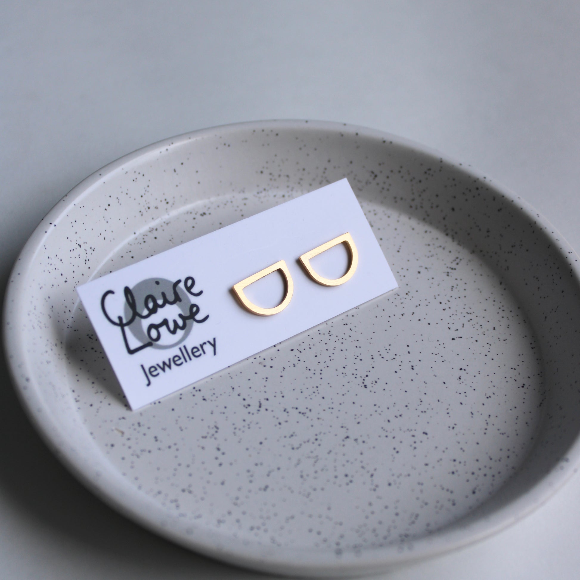 gold arc studs on earring card