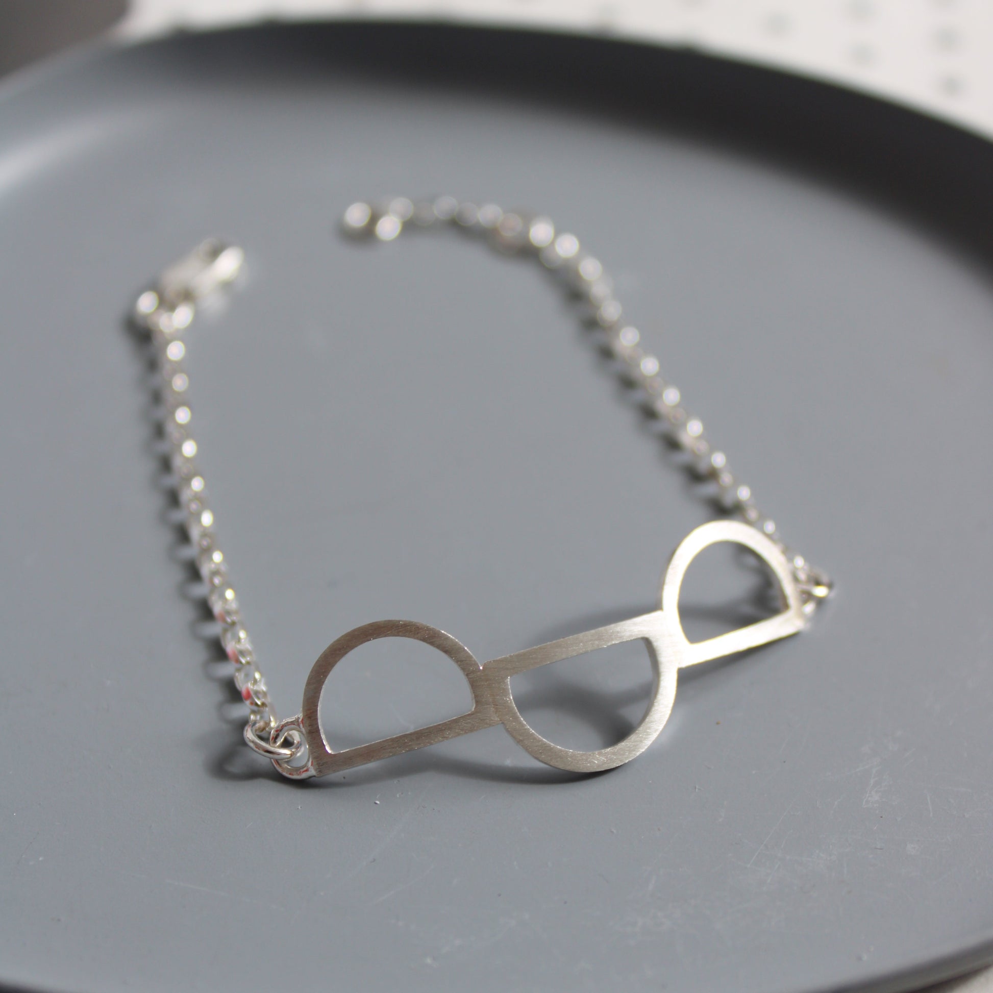 silver triple arc bracelet