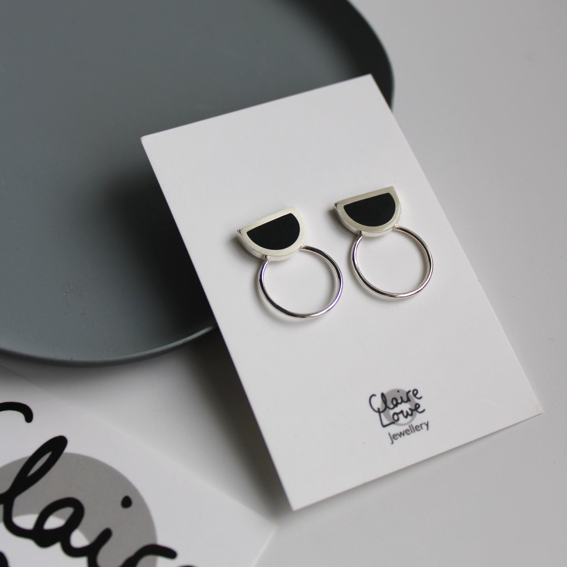 black resin and silver arc circle earrings