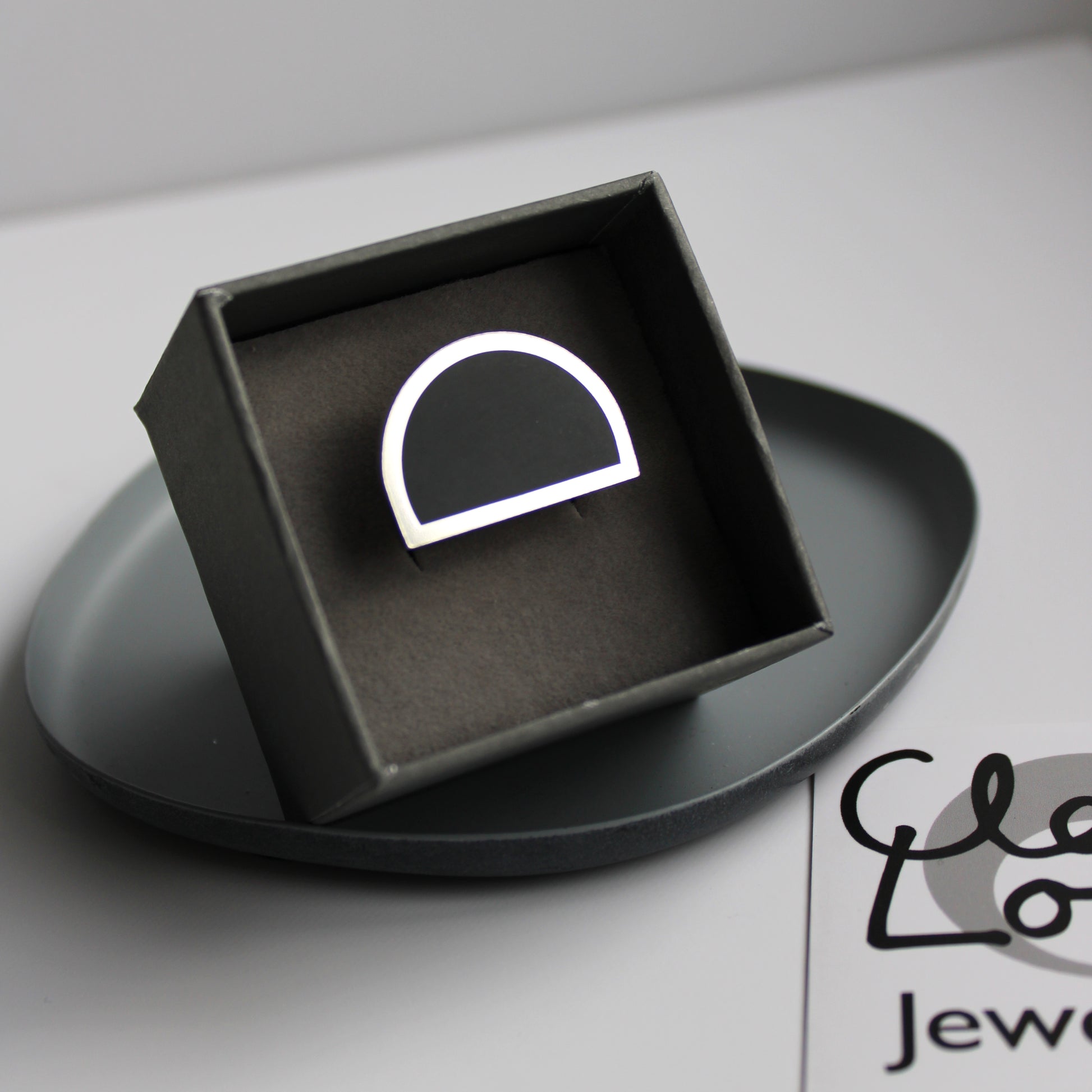 black arc ring in box