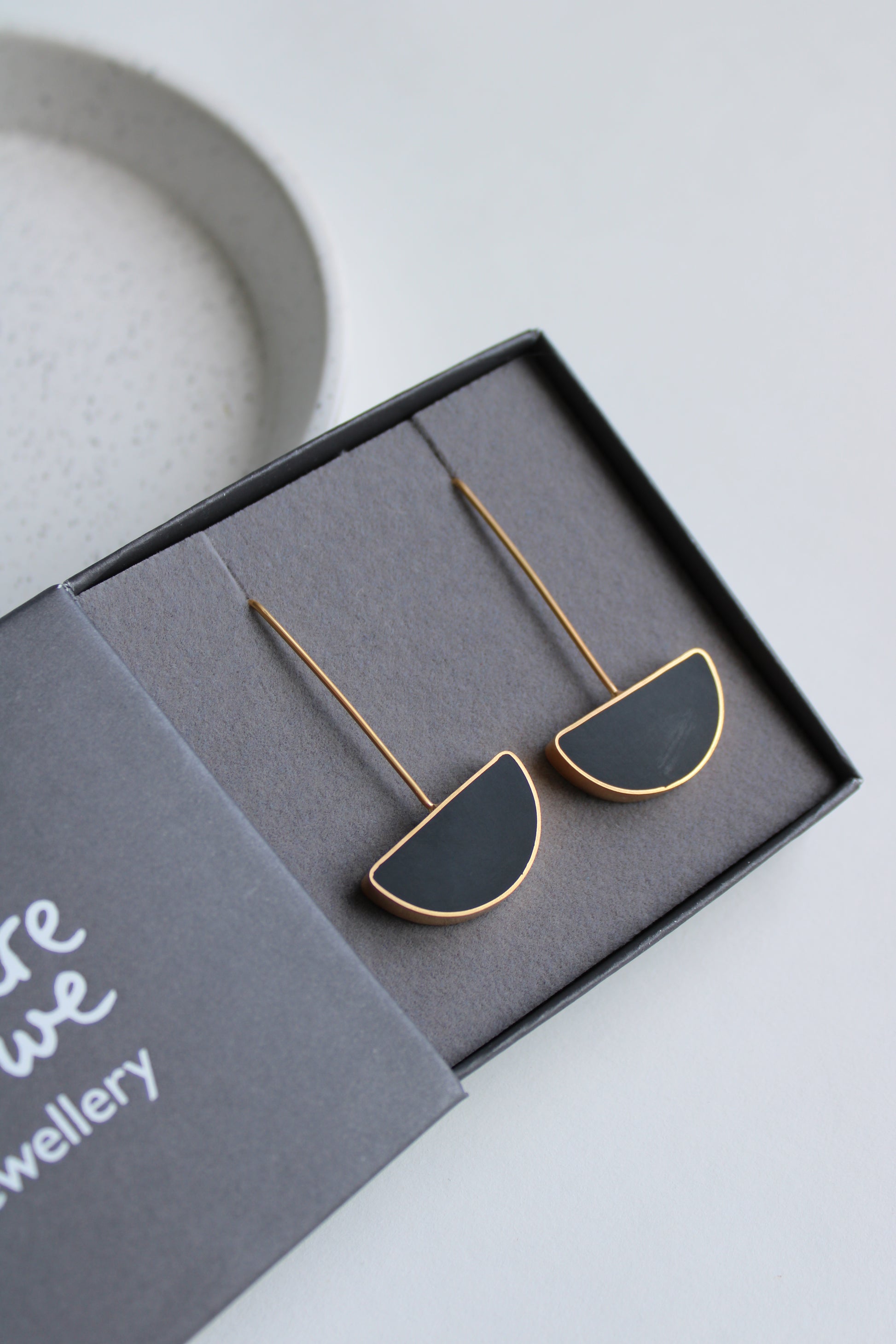 black resin and gold arc earrings