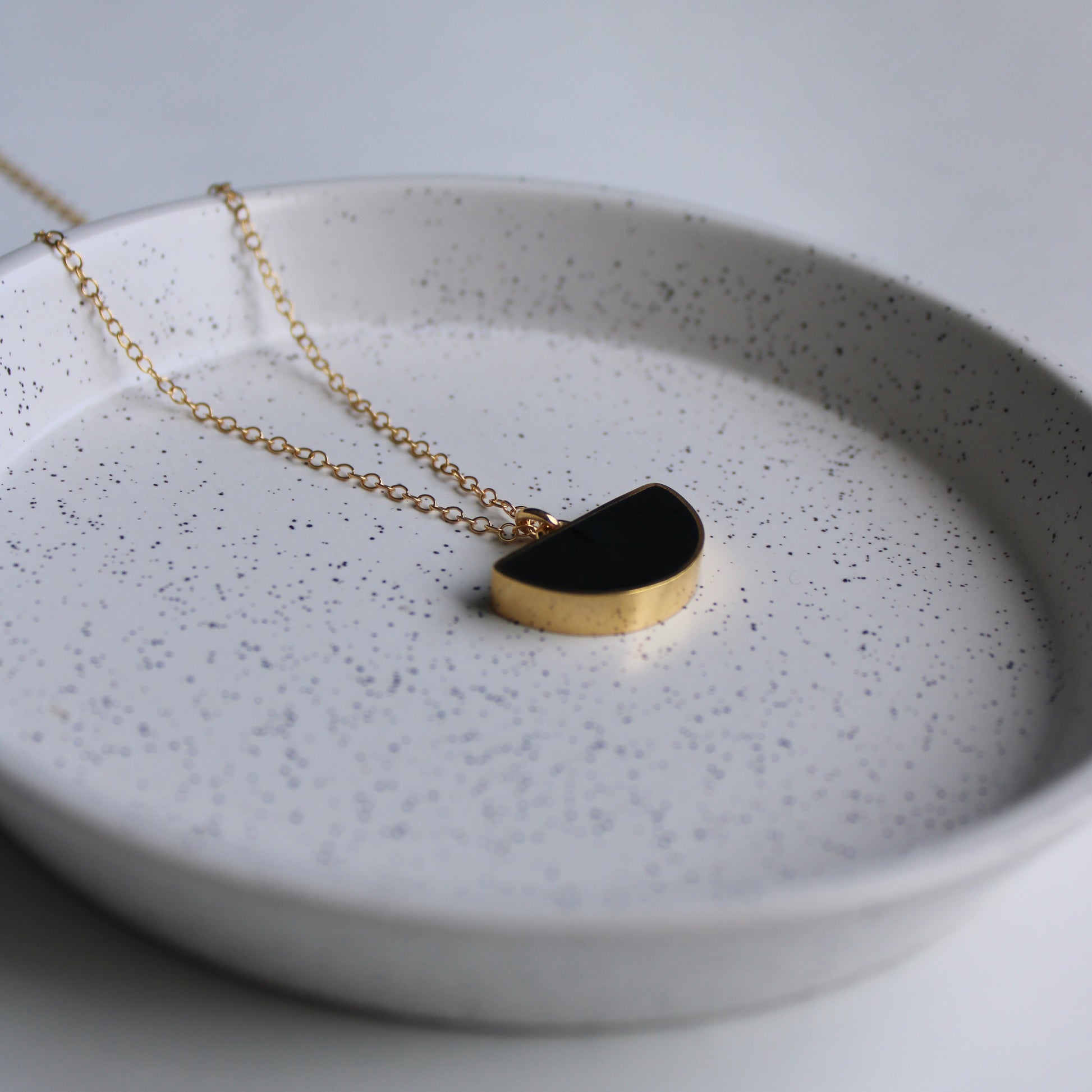 gold vermeil and black resin arc pendant