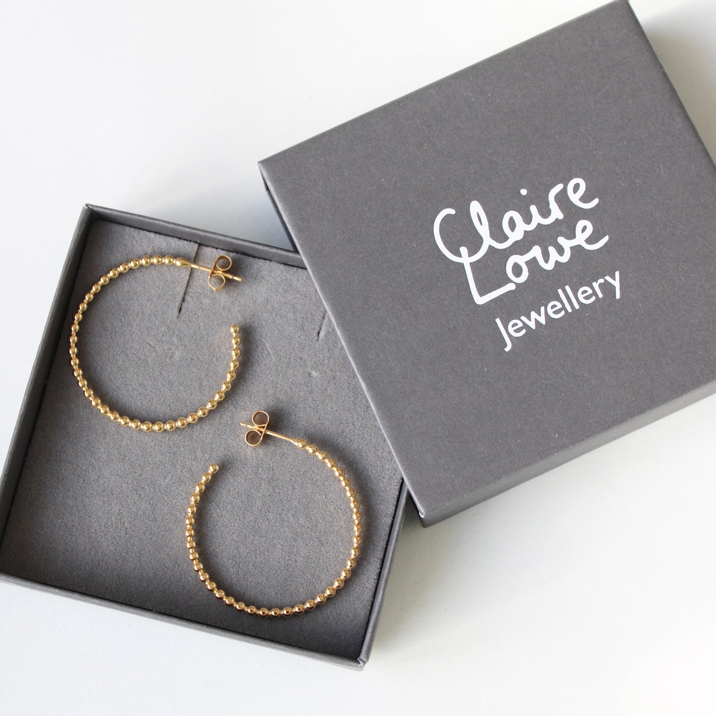 gold hoops in box