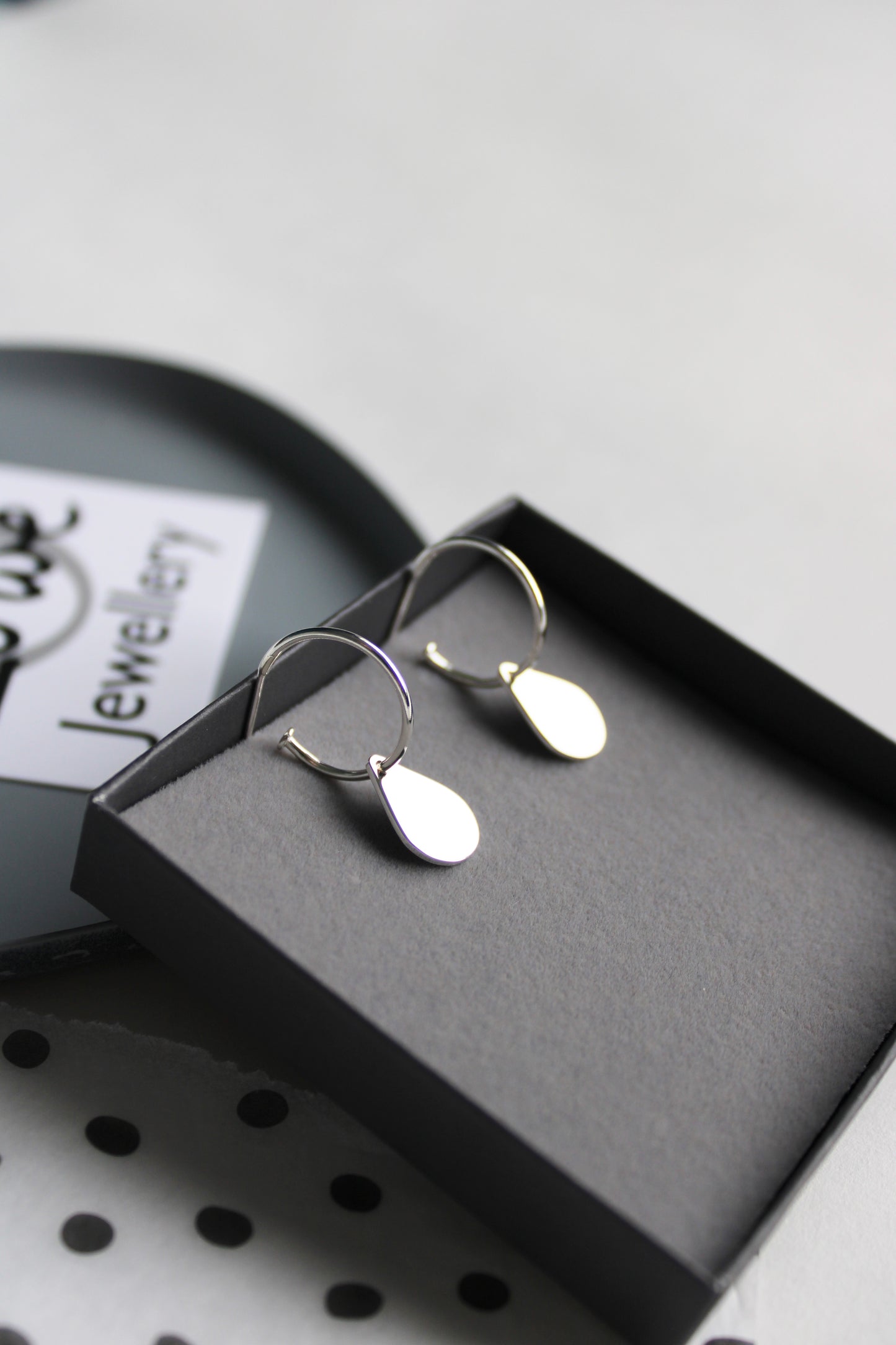 hoops with teardrops in box