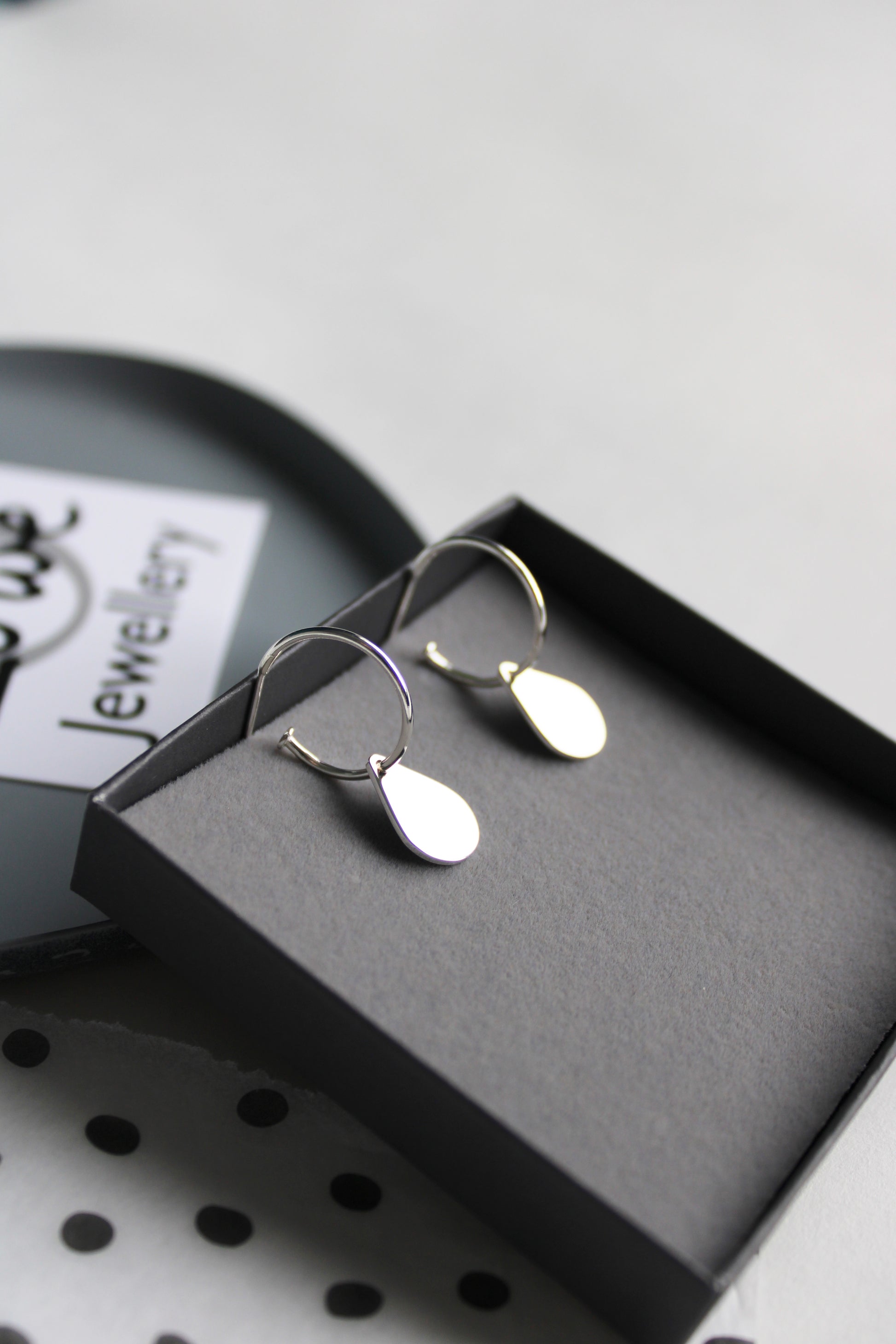 hoops with teardrops in box