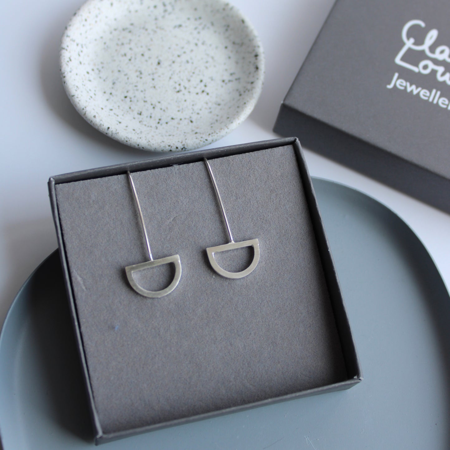 silver arc drop earrings
