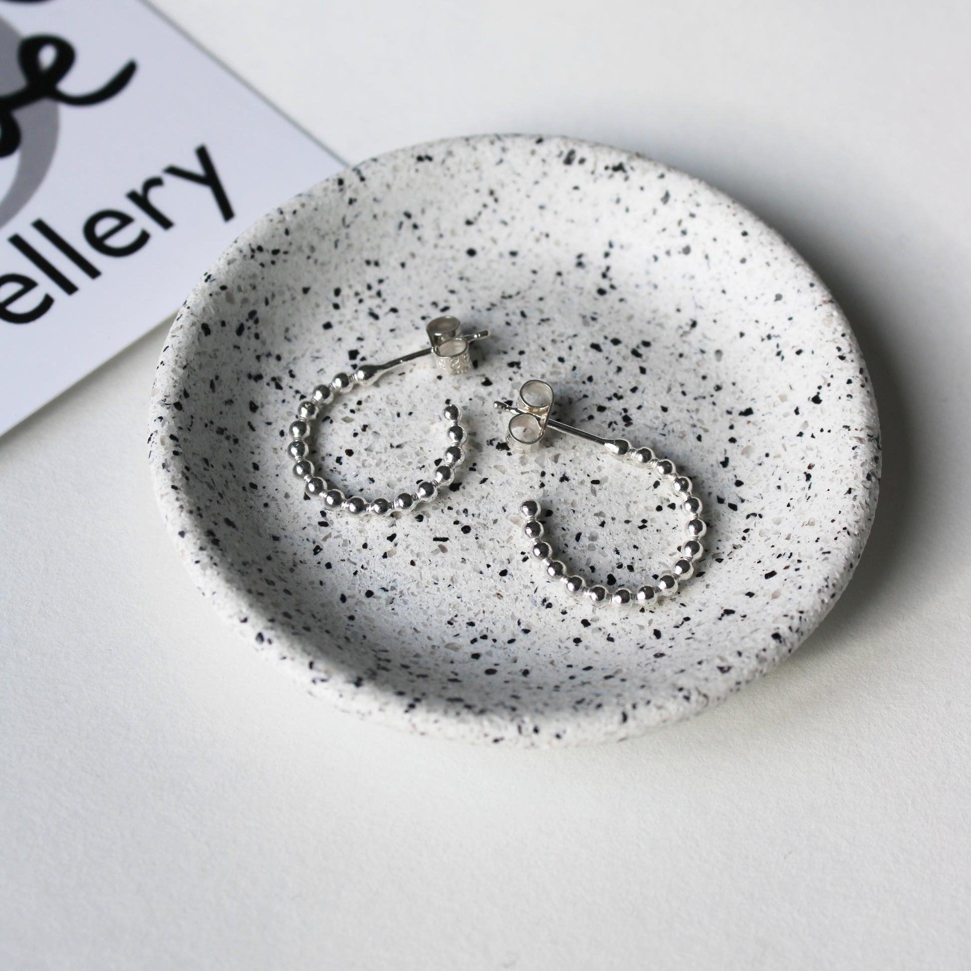 silver dotty hoops small in a dish