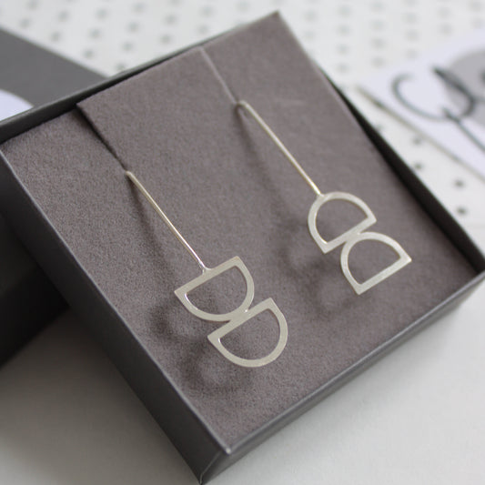 silver odd arc earrings 
