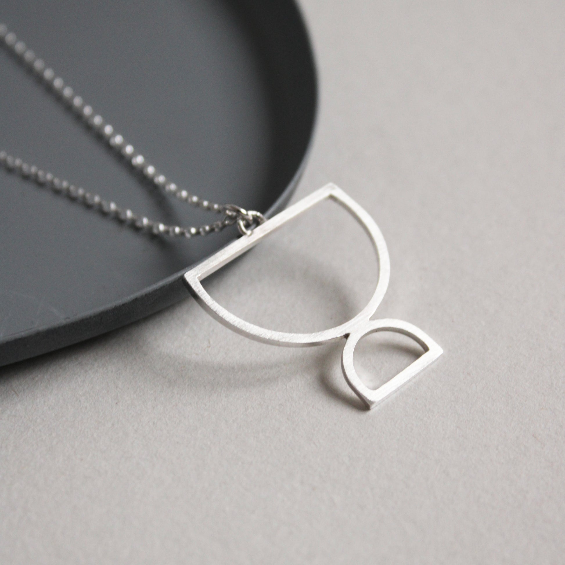silver double arc pendant