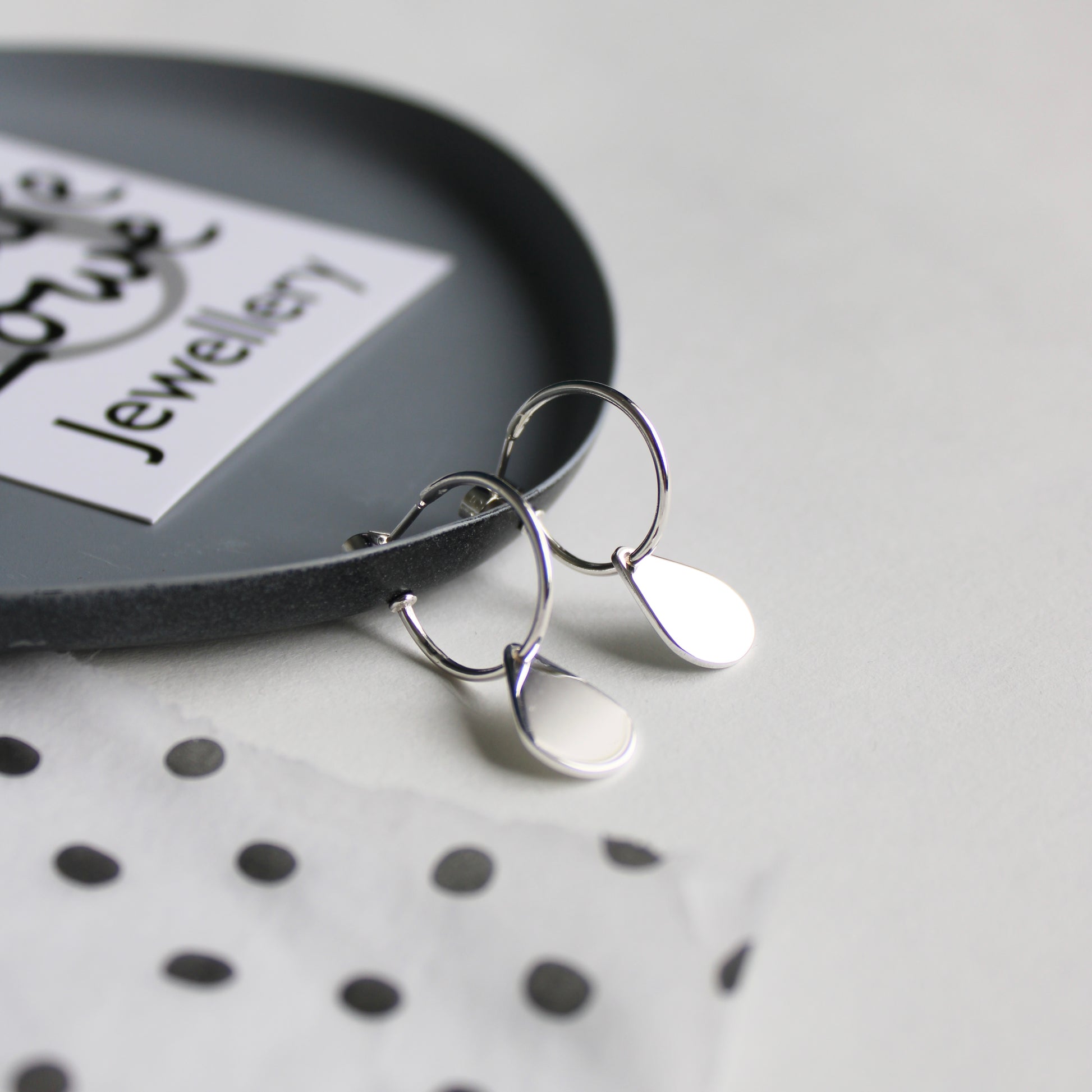 silver hoop earrings with teardrops