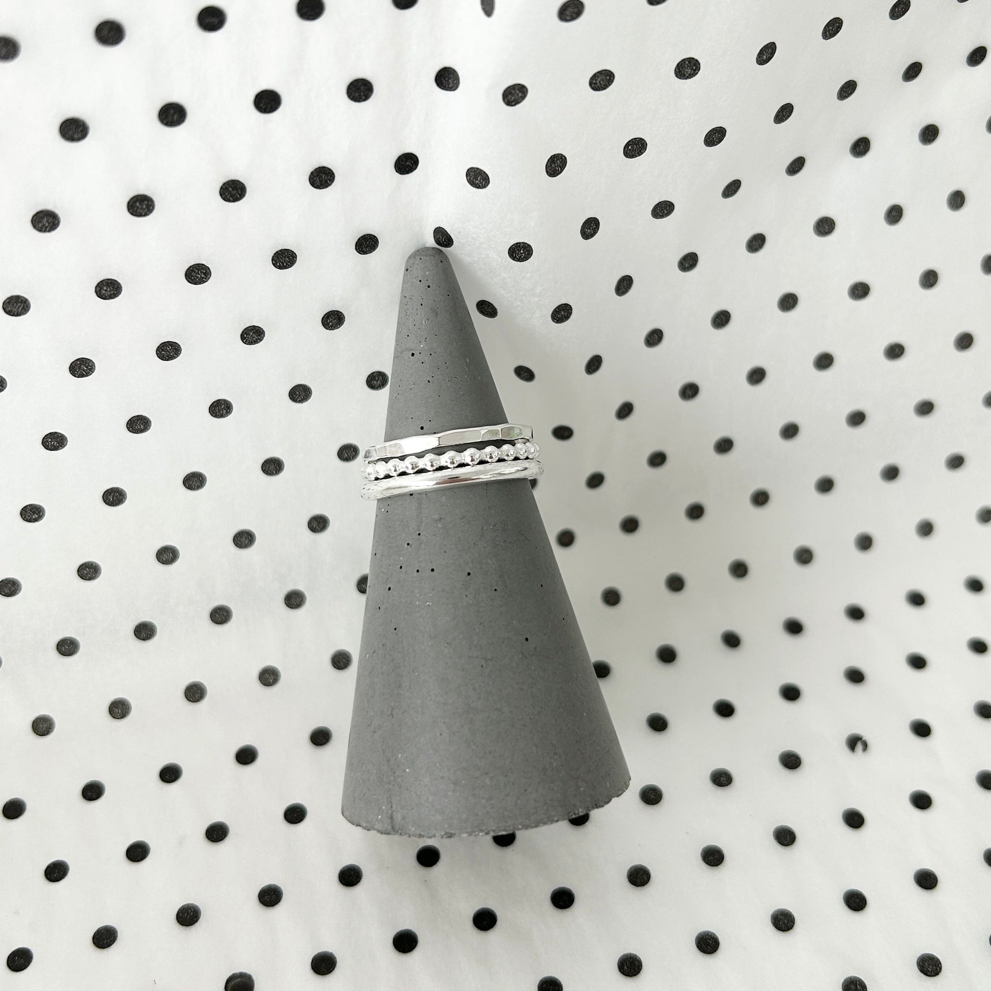 silver ring set on a ring cone