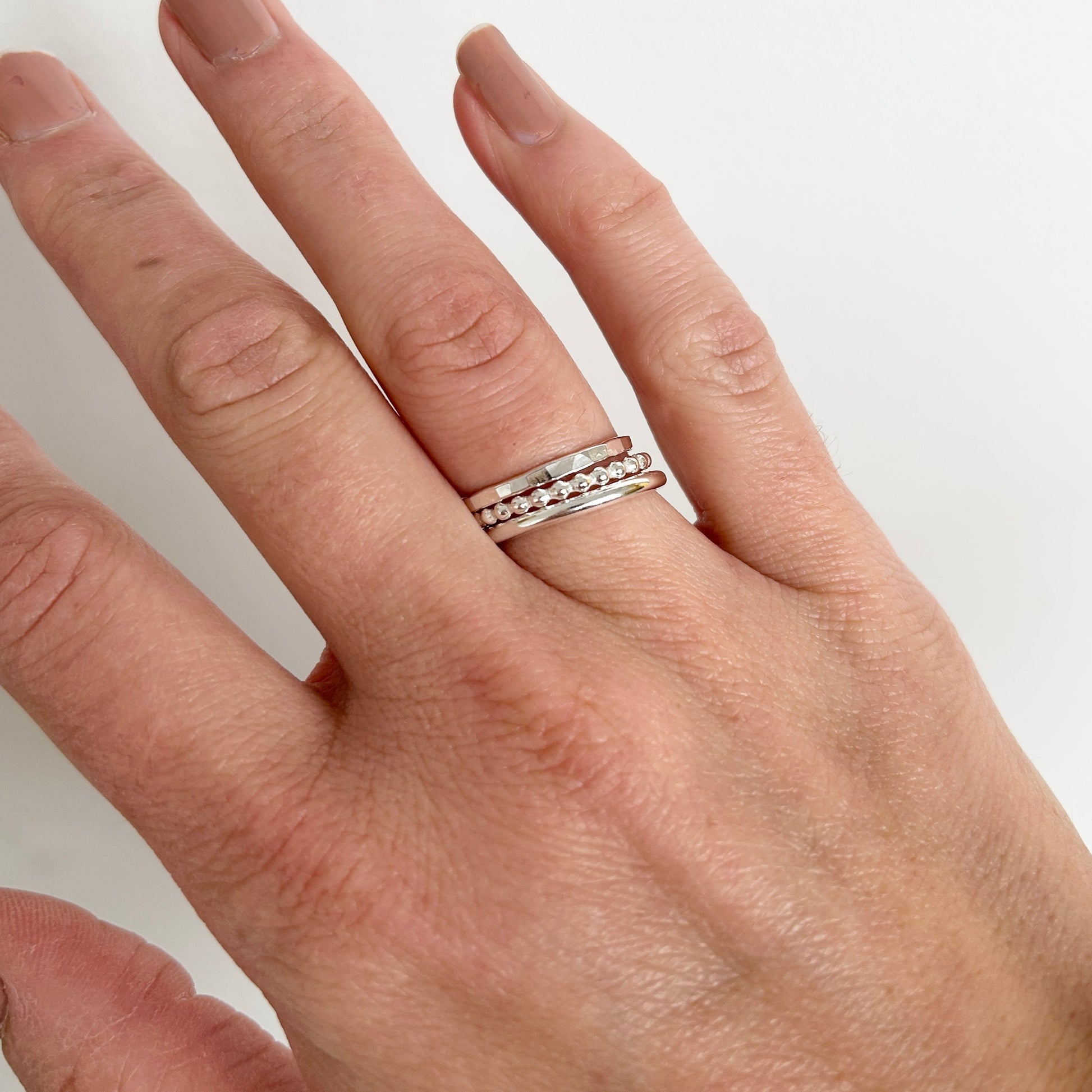 silver stacking rings worn