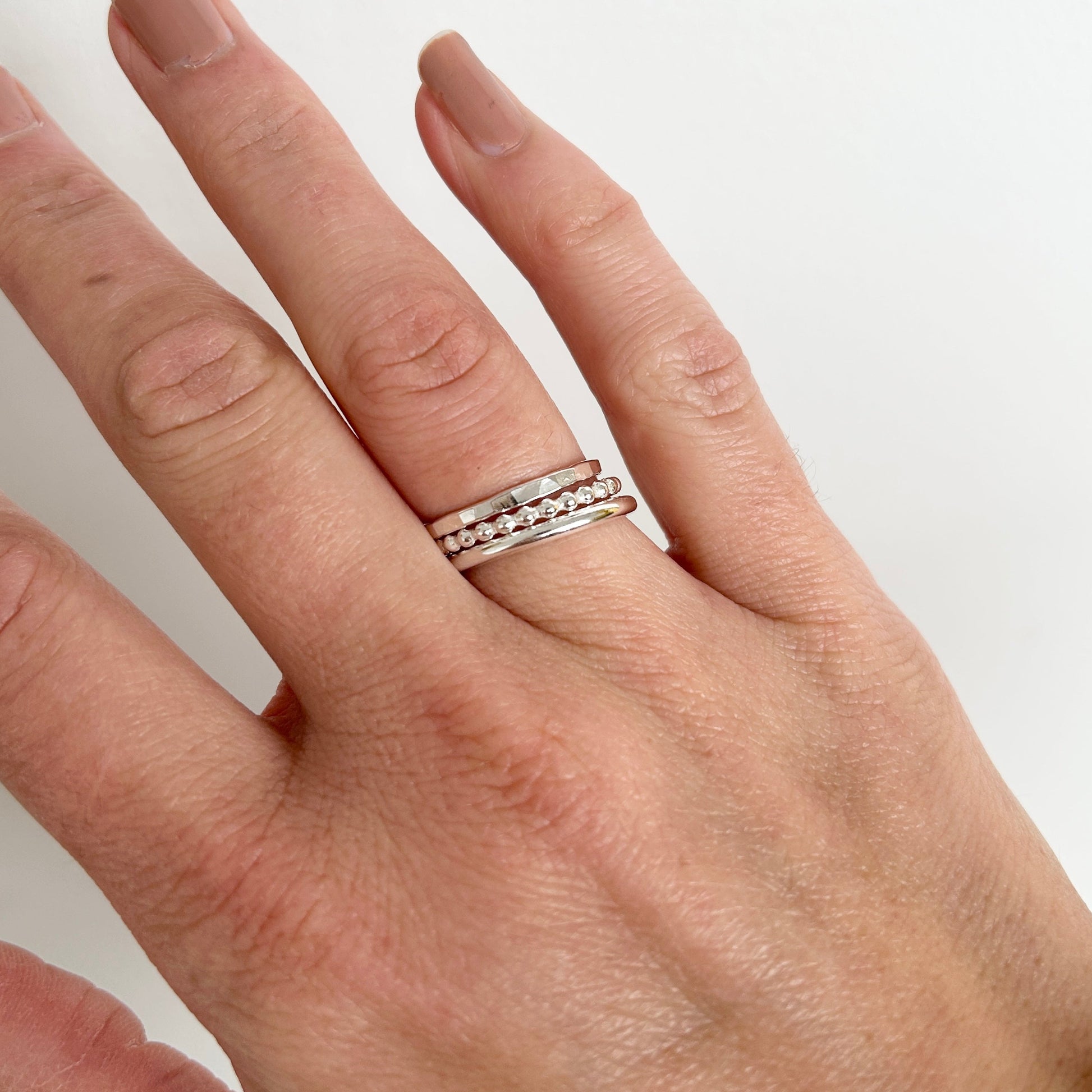 silver stacking rings worn