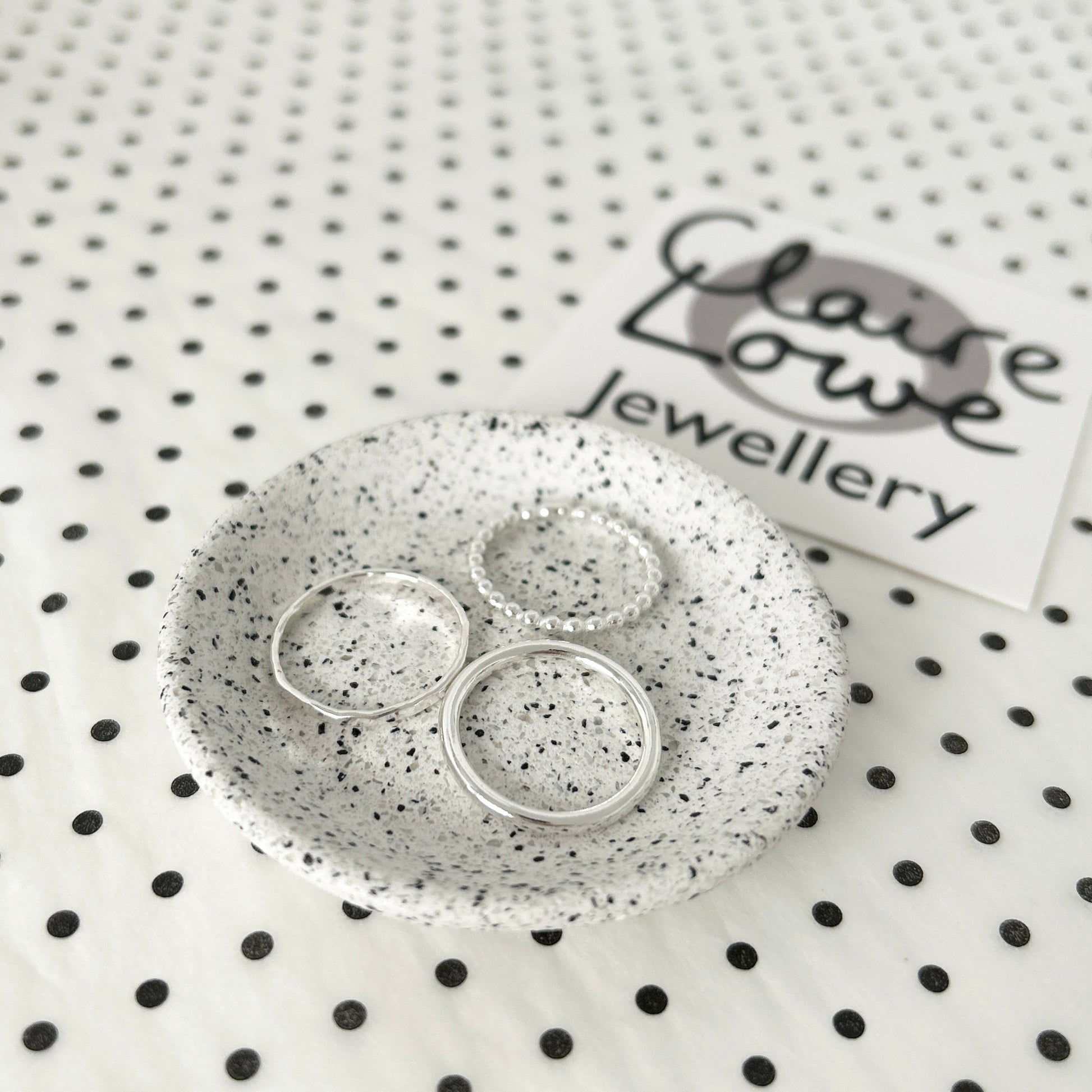 stacking ring set silver, on a dish
