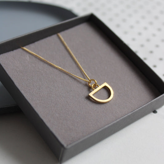 tiny arc pendant gold
