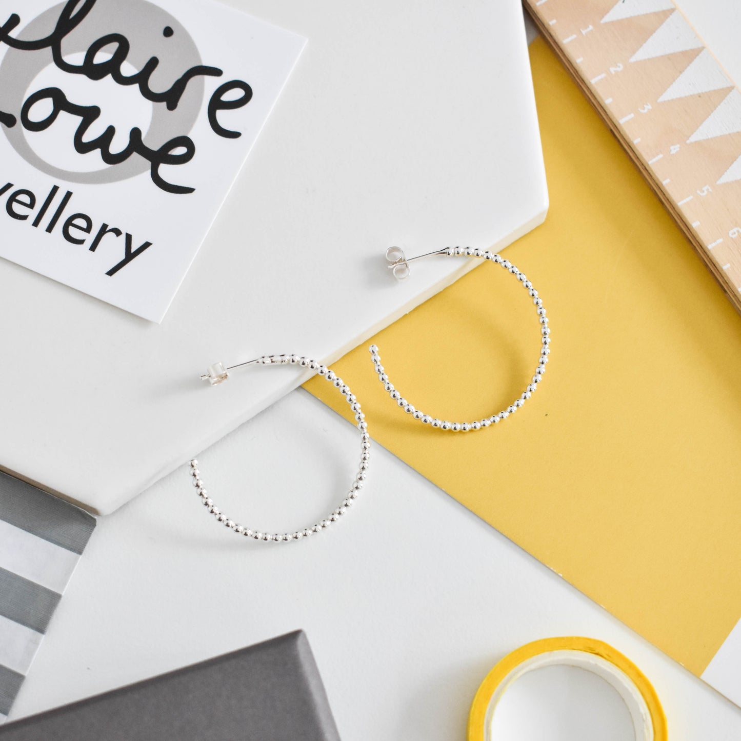 large dotty silver hoop earrings 